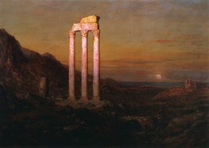 Ruins of an old temple against a landscape at sunset or sunrise