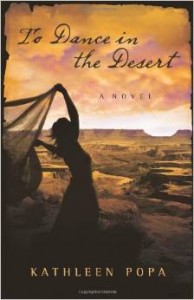 Silhouette of a woman dancing with a shawl against a USA Southwest desert scene with canyons and mesa