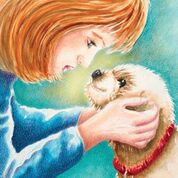 Red haired woman with a blue sweater looking into the dog's eyes.