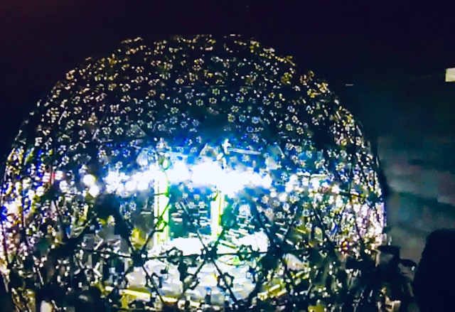 Round dome, lighted stage for theater performance.