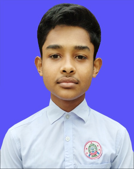 Young South Asian preteen boy with short brown hair and a collared white shirt with a school emblem