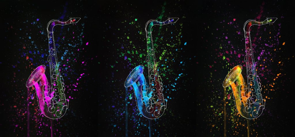 Pink, blue, and yellow splashes of color in three line drawings of saxophones on a black background. Splashes of paint on the instruments. 