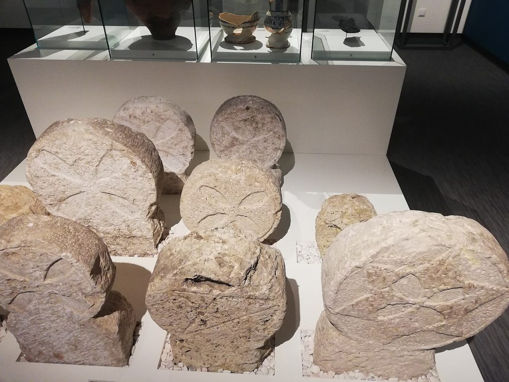 Medieval concrete grave markers on display in the Museum of Lisbon. There are stars of David, crosses, and Muslim pentagrams implying people of different religions and cultures lived together.  