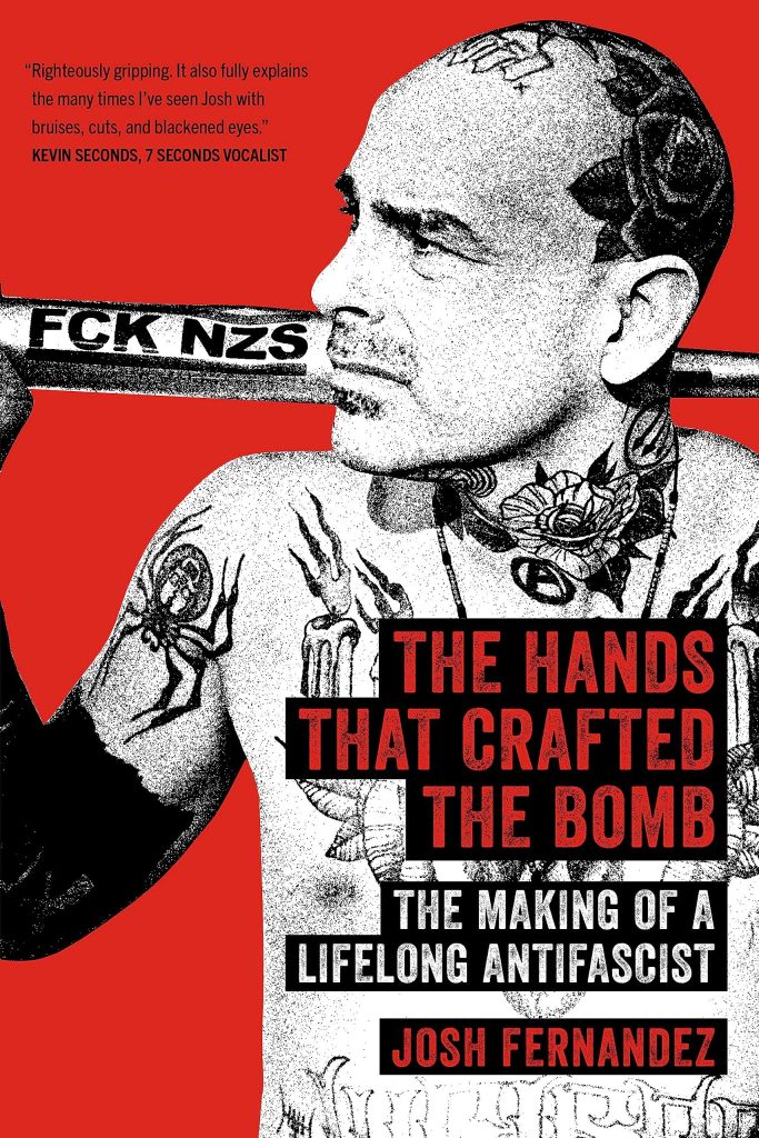 Image of a middle aged shirtless Latino man with a bald head and tattoos. Book is red, gray, and black. Title reads "The Hands That Crafted the Bomb: The Making of a Lifelong Antifascist" by Josh Fernandez.