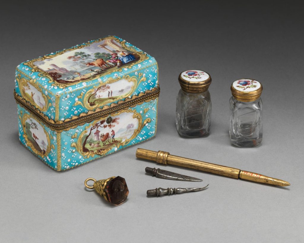 Lacquered jewelry box with pastoral painted scenes, metal pen and tools and a bell and spice jars. 