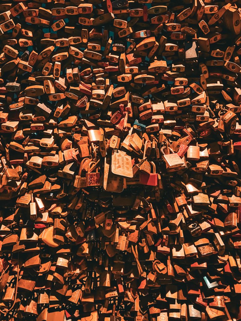 Fence covered in hundreds of brown locks as a symbol of love.
