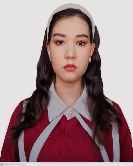 Young Central Asian woman with long dark hair, a white headband, and a red and white collared shirt.