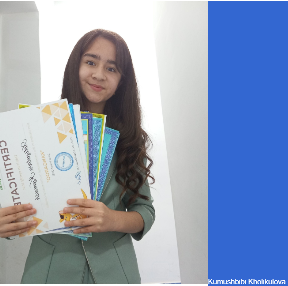 Young Central Asian woman with long dark curly hair and a green top holding certificates.