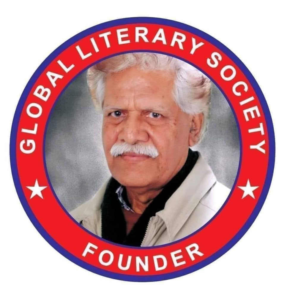 Older South Asian man with white hair and a tan coat encircled by a red and blue circle reading Global Literary Society Founder. 