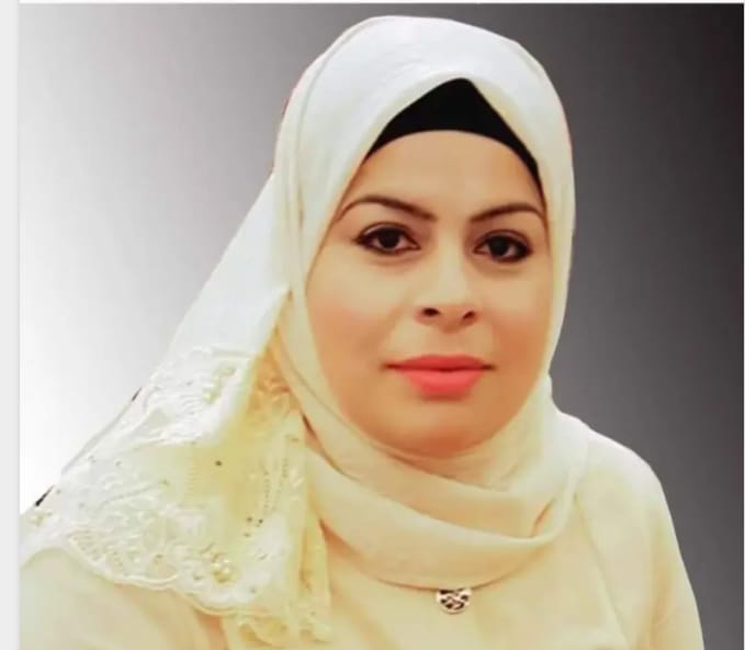 Middle Eastern woman with brown eyes and a white lace embroidered headscarf.