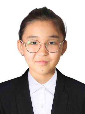 Young Central Asian girl with her hair behind her head, reading glasses, and a black coat over a white collared shirt.