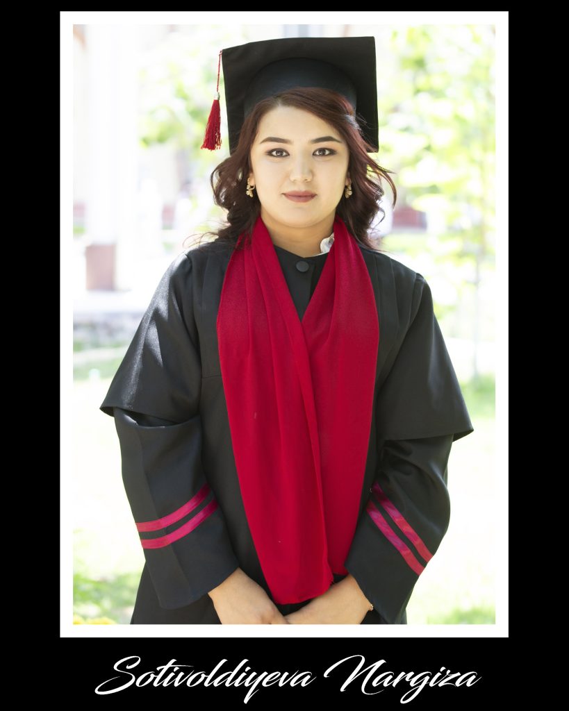 Central Asian woman in a black cap and gown with a red sash. 