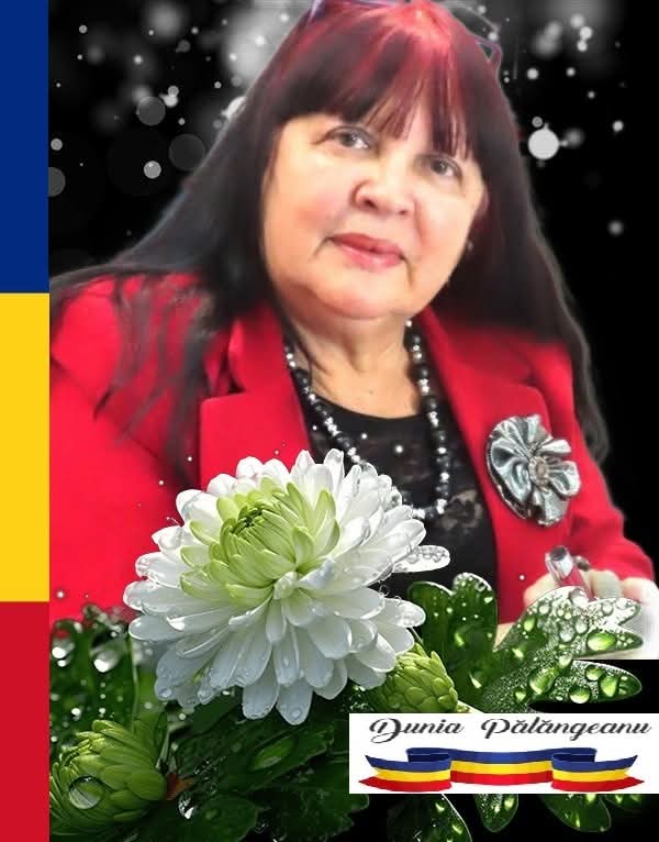 Middle aged woman with straight dark red hair, a red coat, and long necklace and dark patterned top, with a black and white starred background, holding a vase of white flowers.