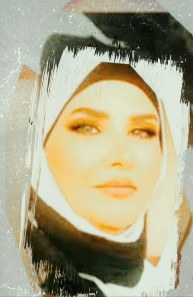 Young Lebanese-South American woman with a black headscarf and a black and white paint background behind her. 