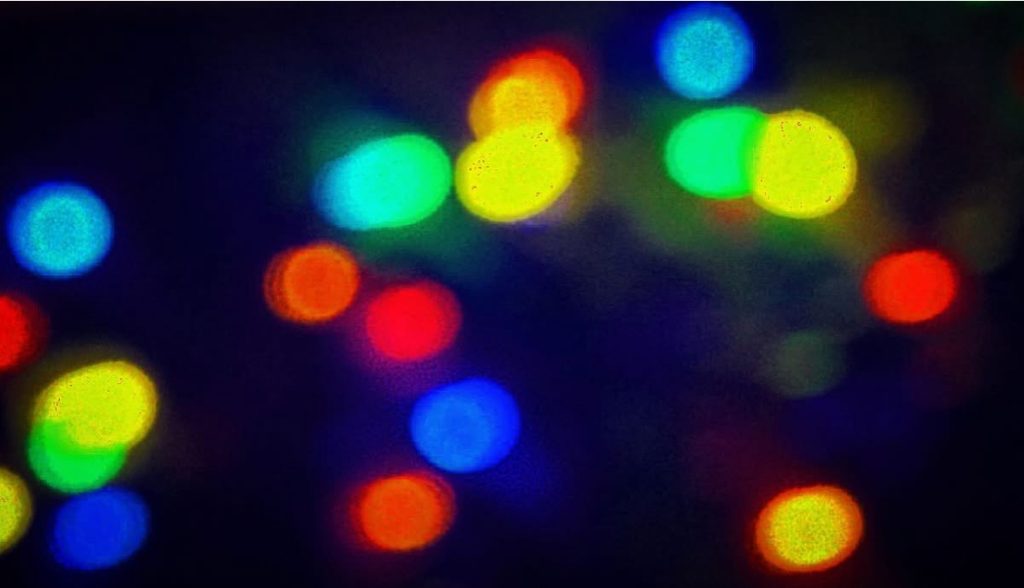 Many colored lights against a dark sky.