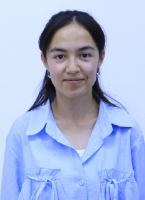 Young Central Asian woman with long straight dark hair and a blue collared shirt.