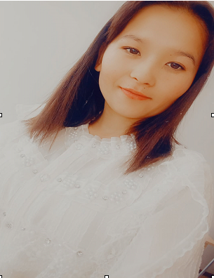 Young Central Asian woman in a white blouse with straight dark hair.