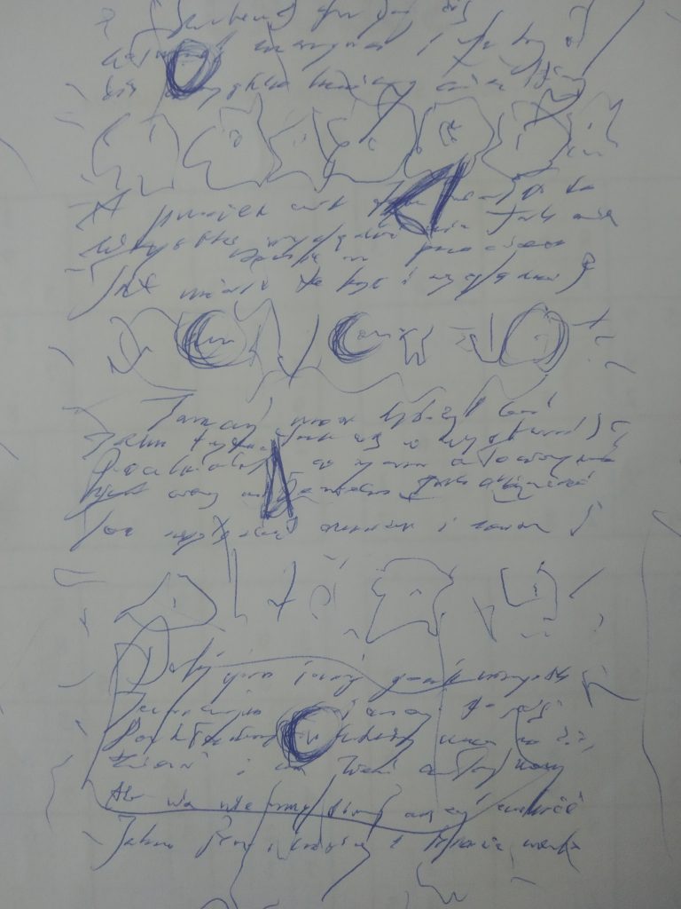 Blue scribbles on white paper